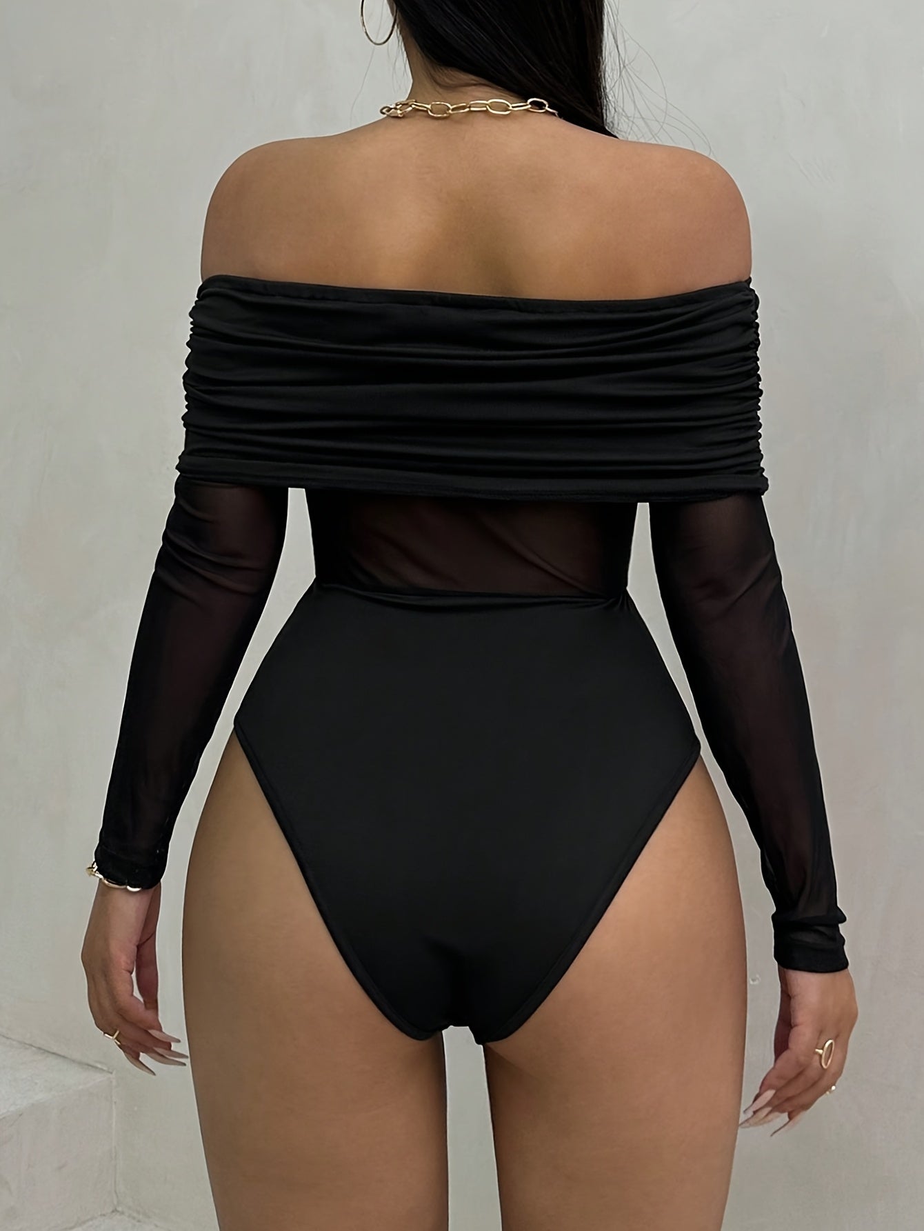 Elegant Off-Shoulder Long Sleeve Knit Bodysuit with Mesh Detail - High Stretch, Solid Black, Ruched Design, Perfect for Fall/Winter Women’s Fashion, Fall Fashion Top | Offshoulder Bodysuit | Nontransparent Fabric